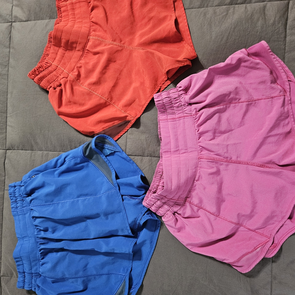3 Pair Bundle Of Lululemon Hotty Hot Shorts;  Red, Pink And Blue